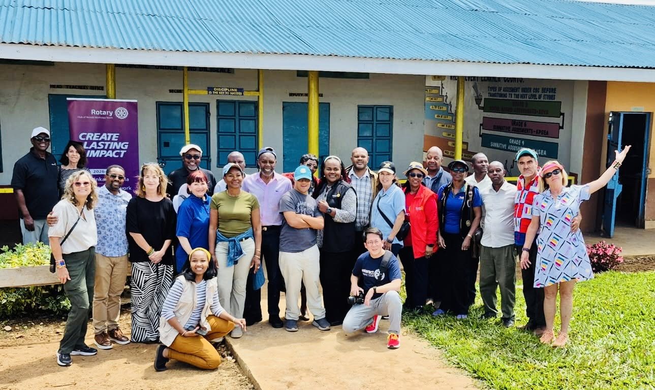 Irvine and District 5320 Rotarians with Kenyan Rotarians in front of a school in Kenya